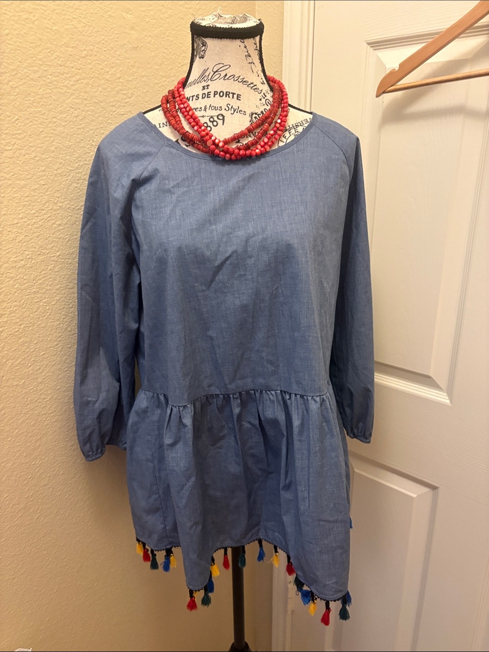 Pleione Chambray Peplum Top with Colorful Tassels